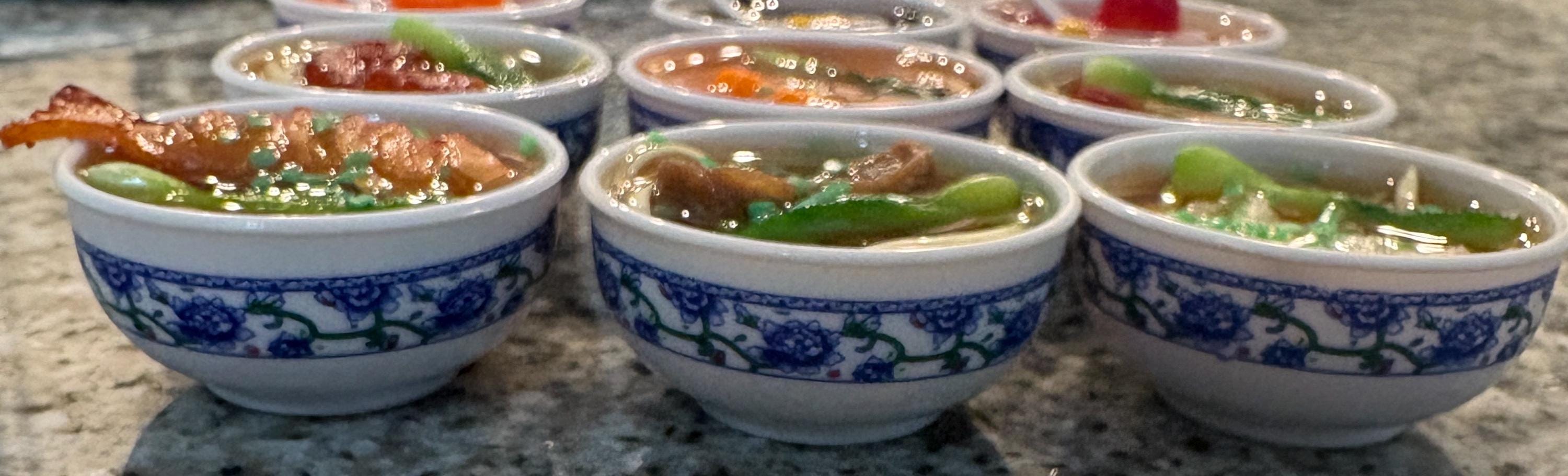 Small bowls with food on a stone surface