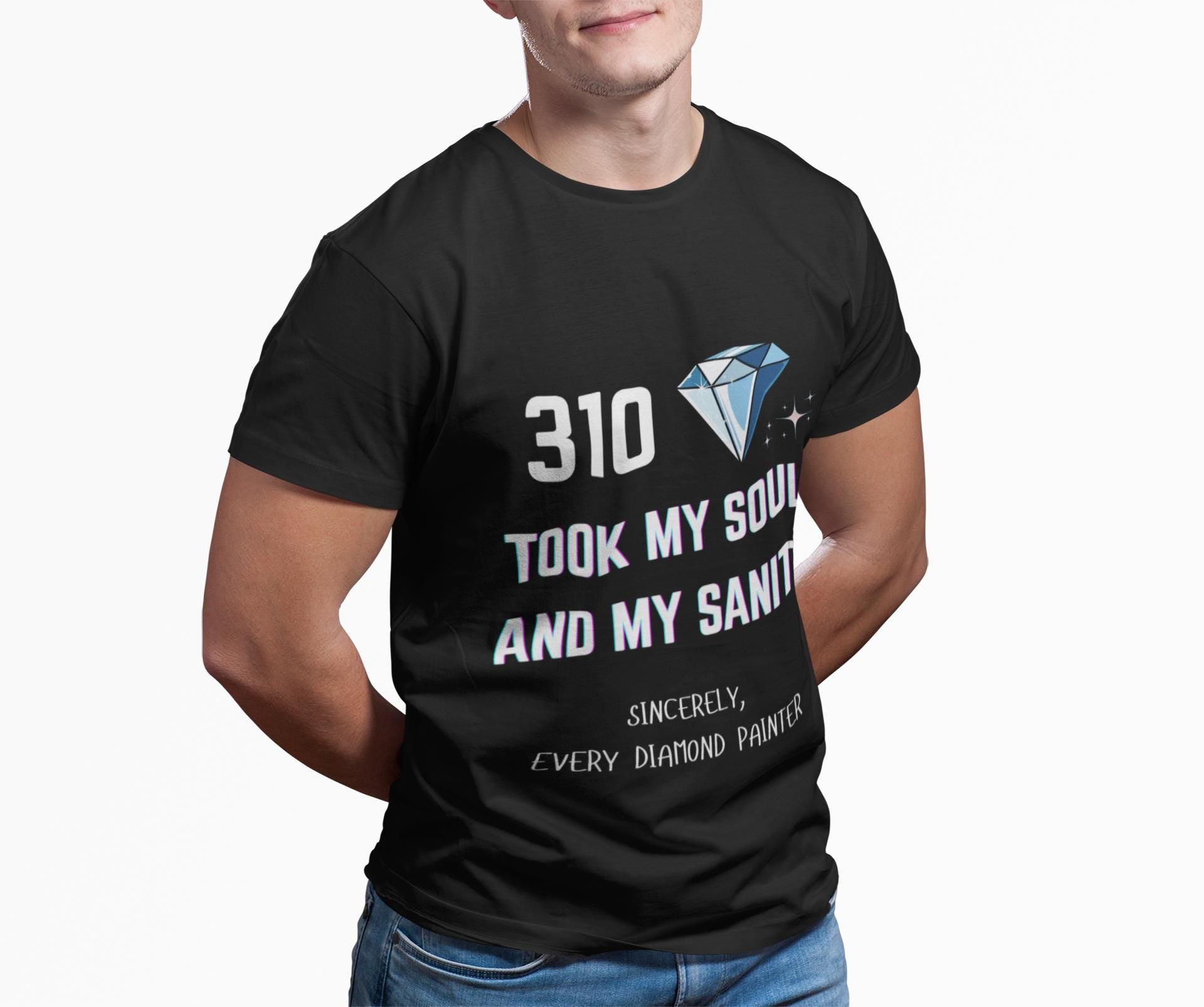 Person wearing a black t-shirt with text and a diamond graphic on a white background