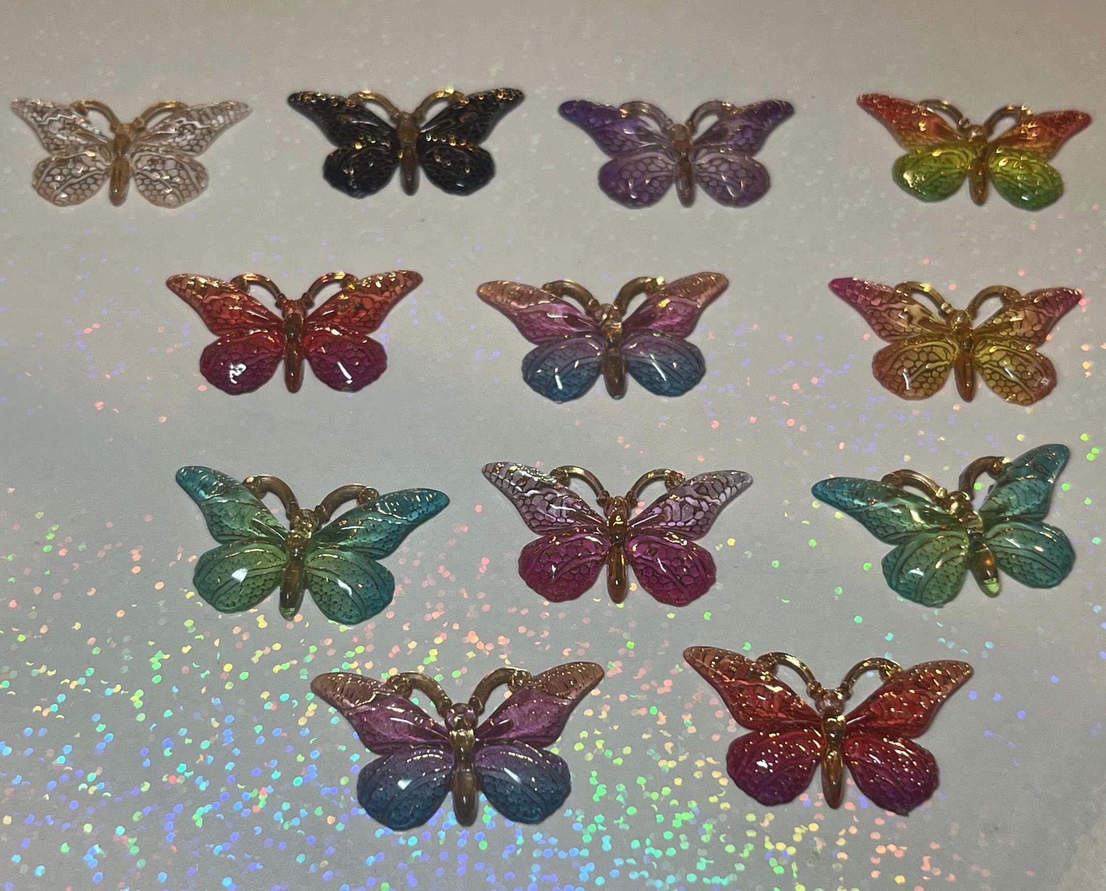 Multicolored butterfly-shaped objects on a reflective surface